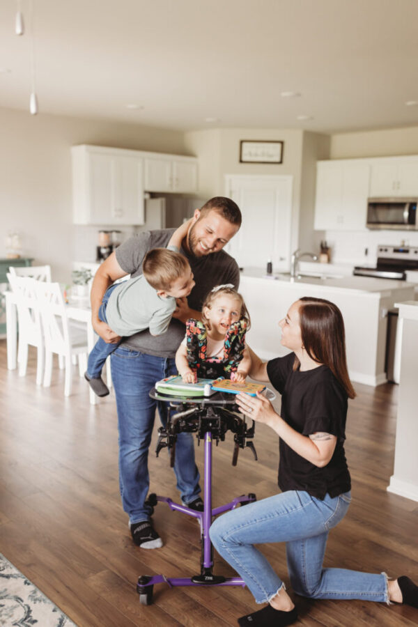 Zing Prone Stander Family Playing Together